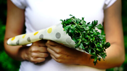 food wrap in hand with parsley